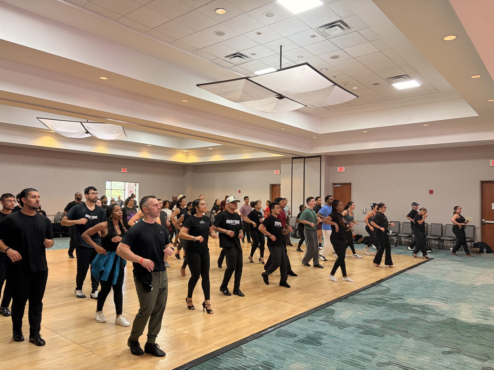 The whole room drilling footwork together